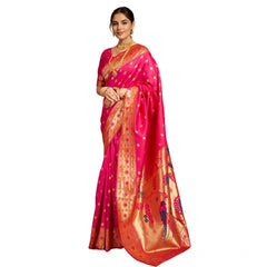 Woman wearing a pink saree with gold border on a white background