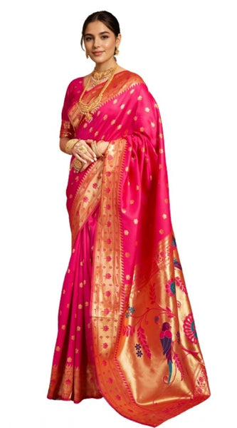 Woman wearing a pink saree with gold border on a white background